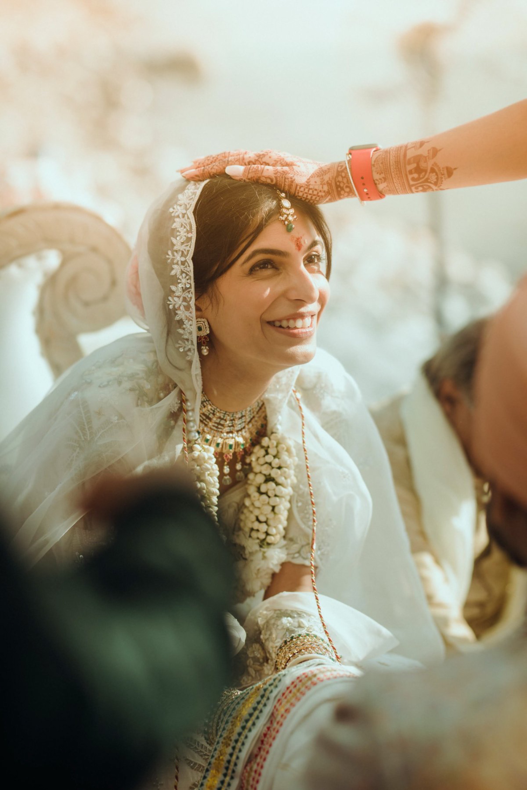 Blessing the bride during an Indian wedding ritual, photographed by WeddingClickz