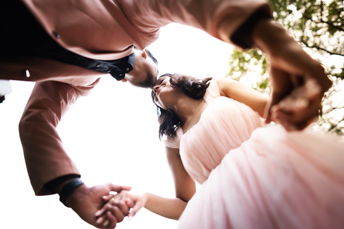 Pre-wedding couple shoot by WeddingClickz — hands and a turn, caught mid-movement