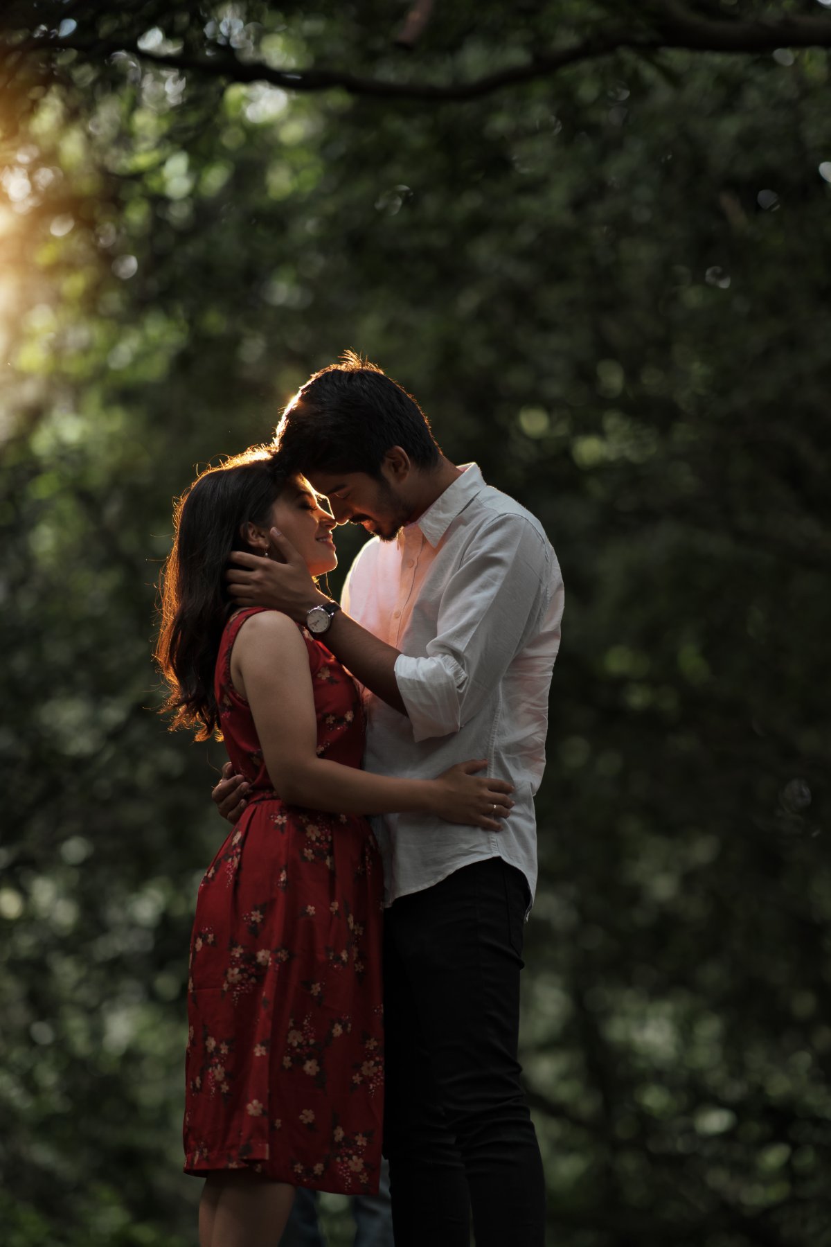 Pre-wedding couple shoot by WeddingClickz — quiet moment under trees