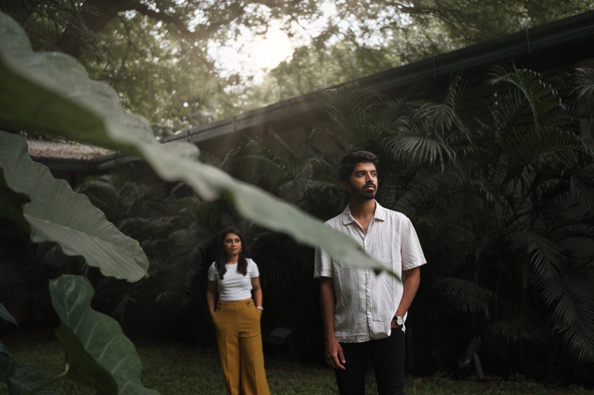 Pre-wedding couple shoot by WeddingClickz — foliage as a frame